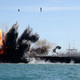 Illustration for article titled Iran Blows Up Gigantic U.S. Carrier Mock-Up During Naval Exercise